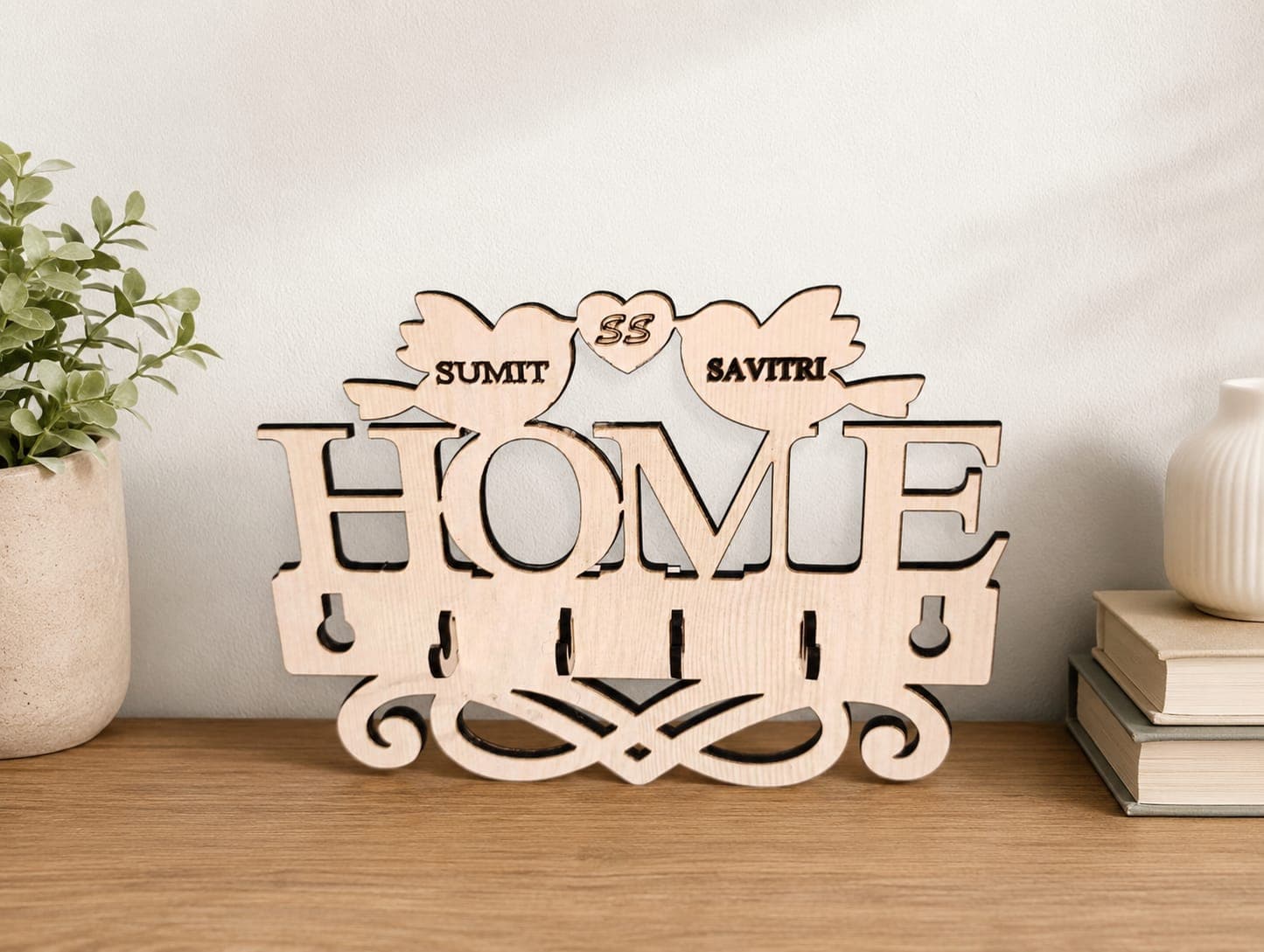 “Home” key holder personalised with a couple's names